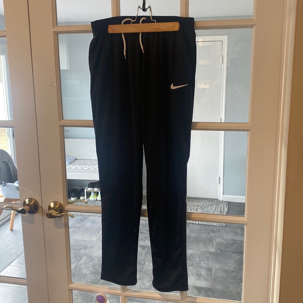 Nike all black warm up pants. Mens size medium.